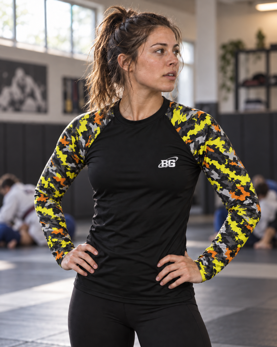Female grappler wearing the Hazard Splash camo BJJ rash guard